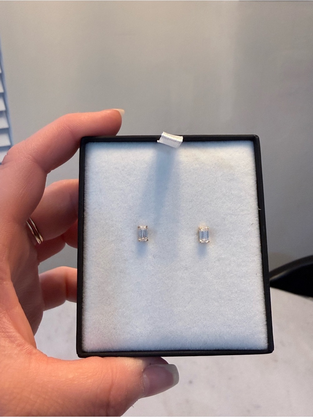 Roum gold plated emerald cut lab grown diamond earrings.